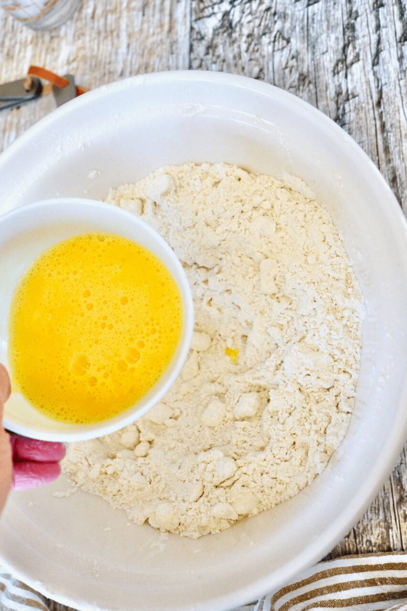 Add beaten eggs to flour and butter mixture.