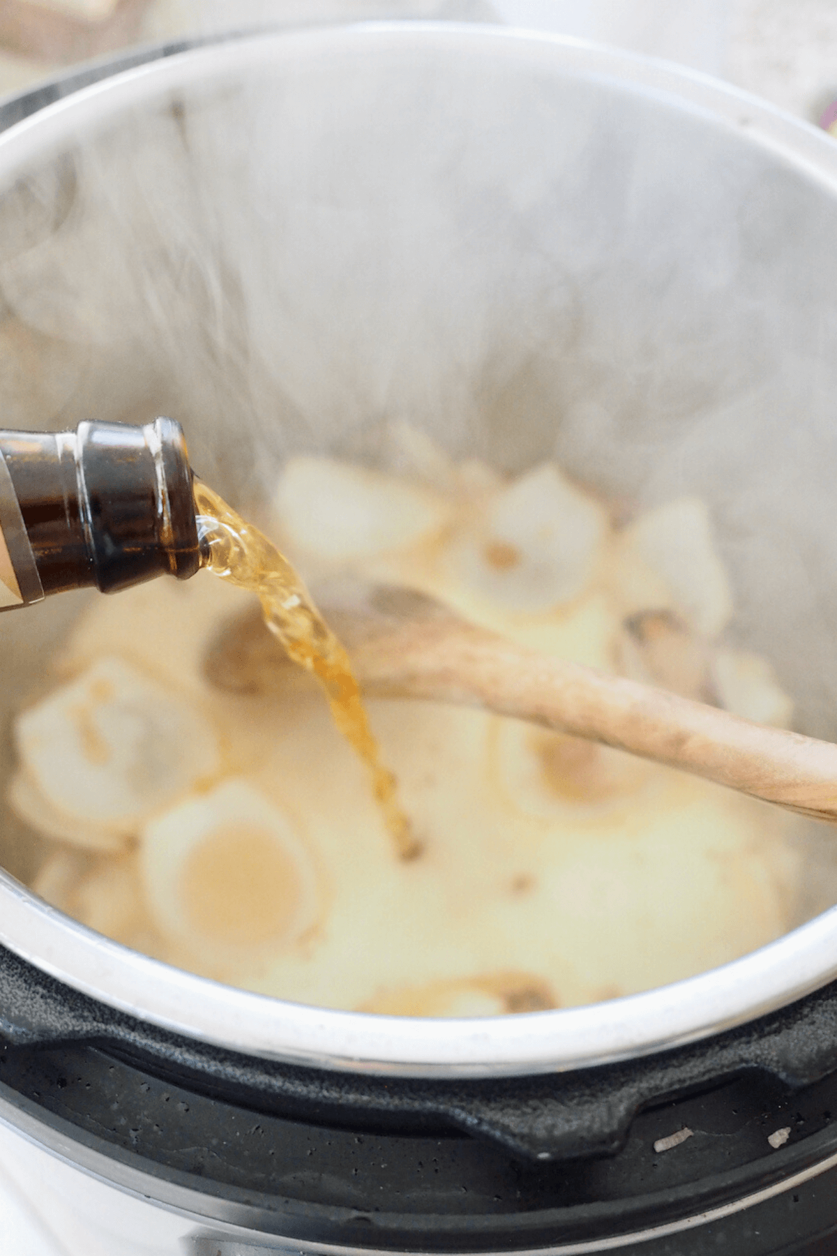 Deglaze pot with beer, stirring to get up browned bits on bottom. 