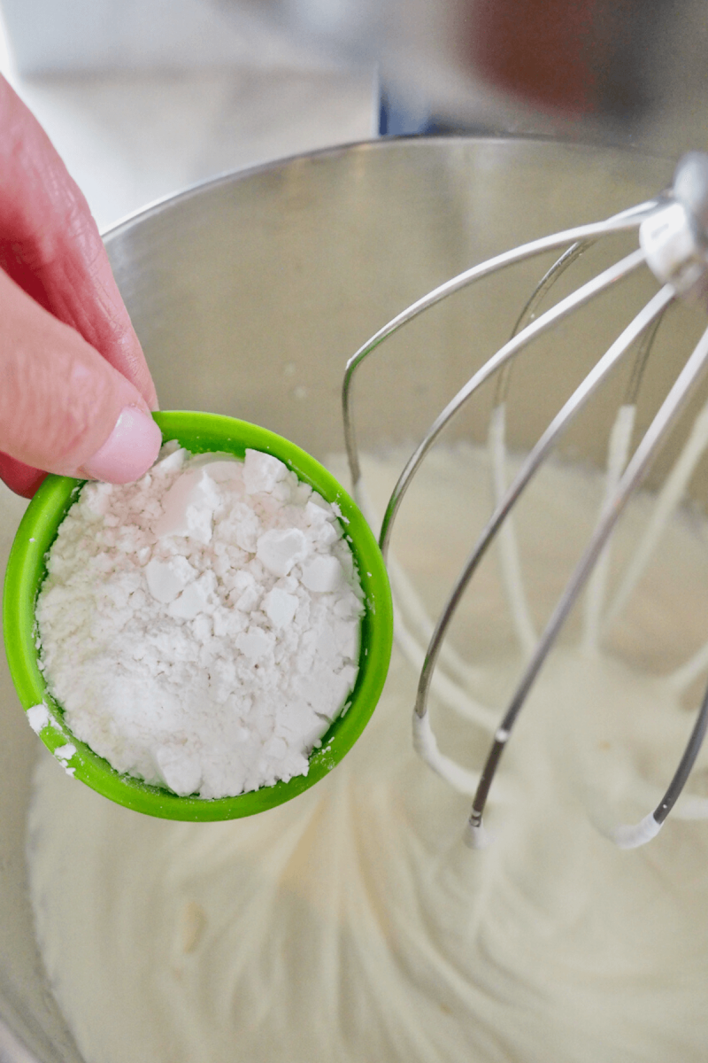 Adding powdered sugar to soft whipped cream for stabilized whipped cream. 
