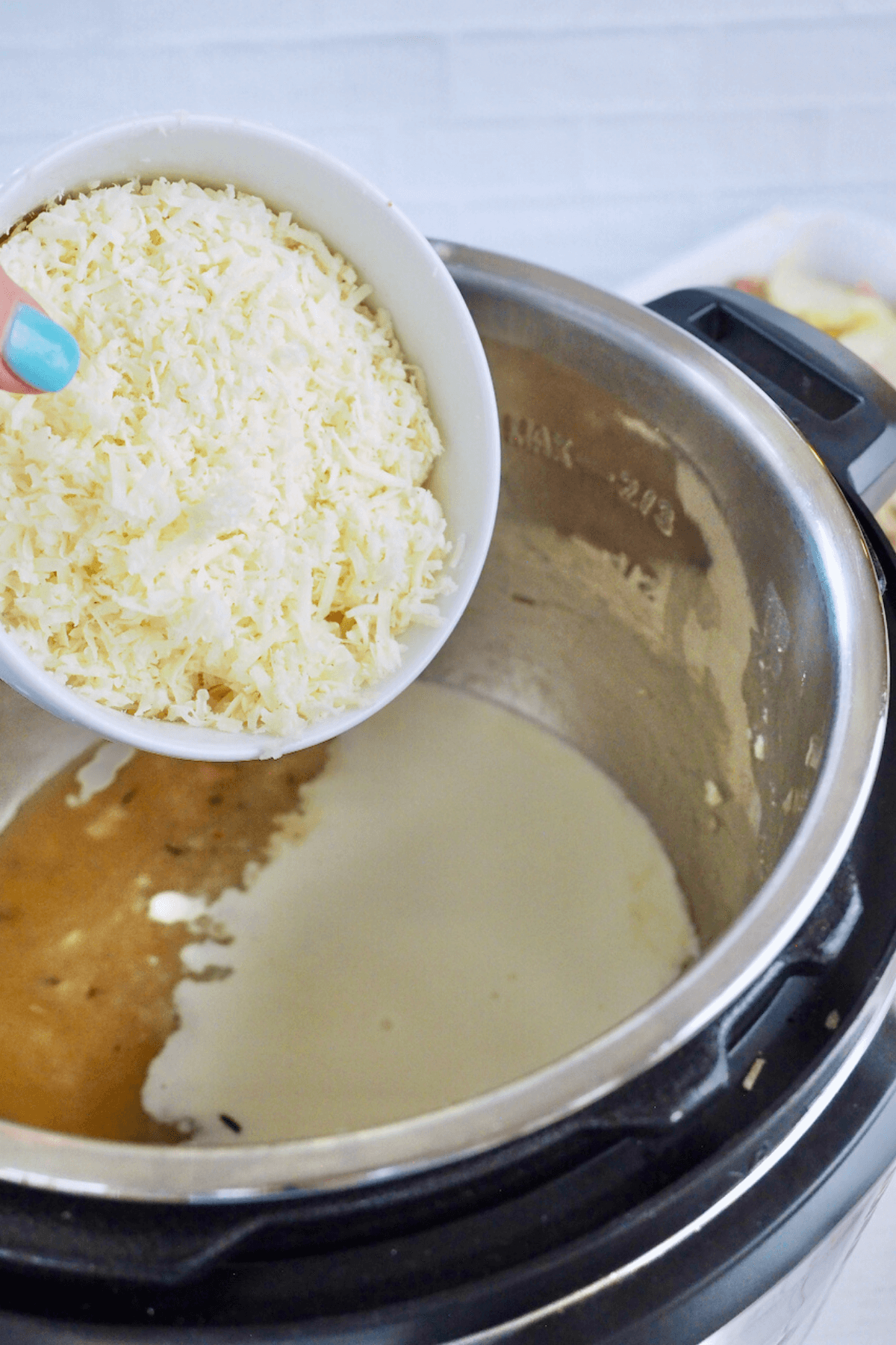 Stir in 1 ½ cups of shredded cheese, stir until smooth and melted. 
