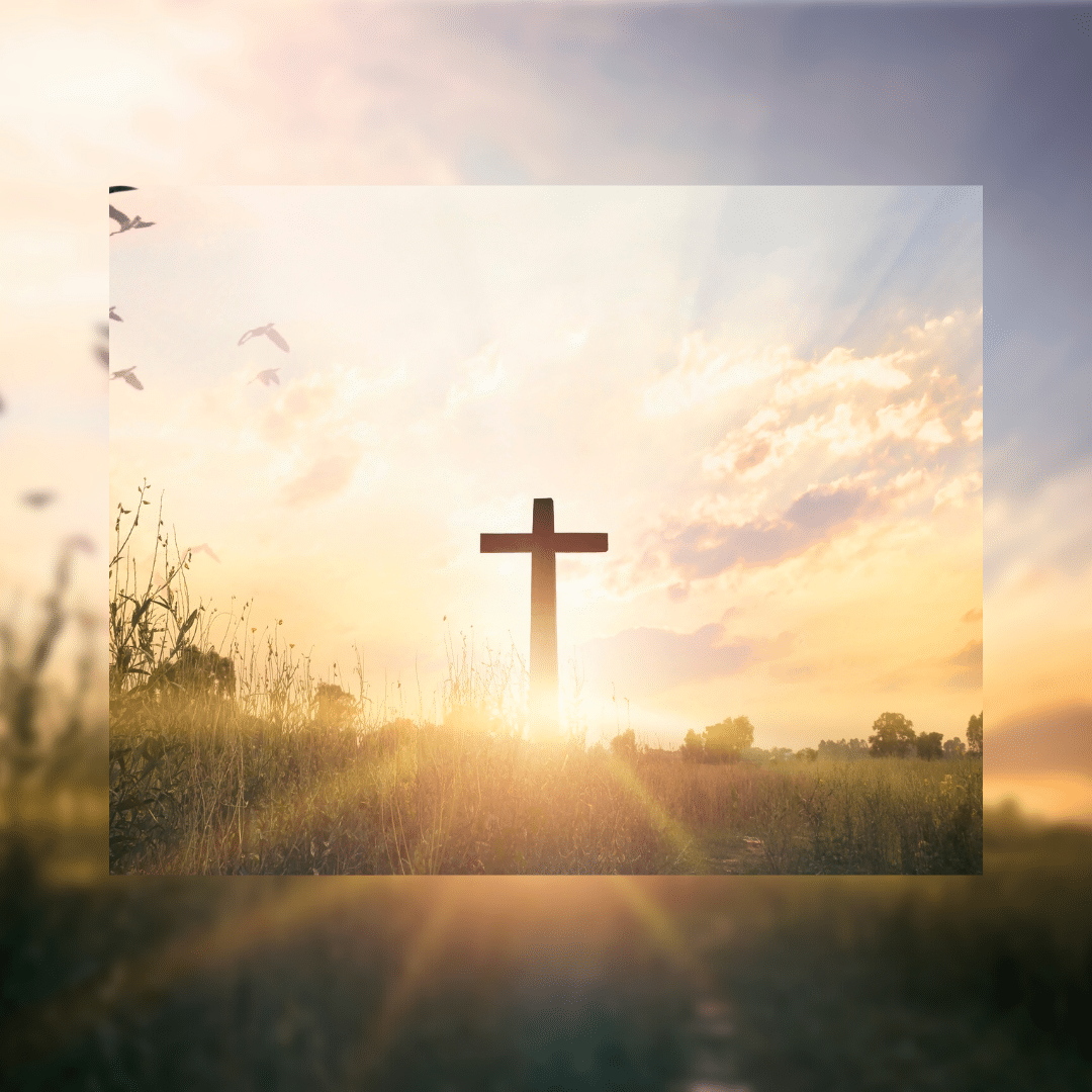 Image of a cross with the sun shining behind it.