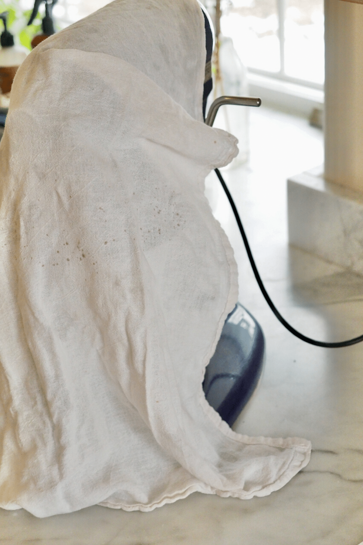 Tea towel over top of kitchenaid blender, for homemade Cool Whip.