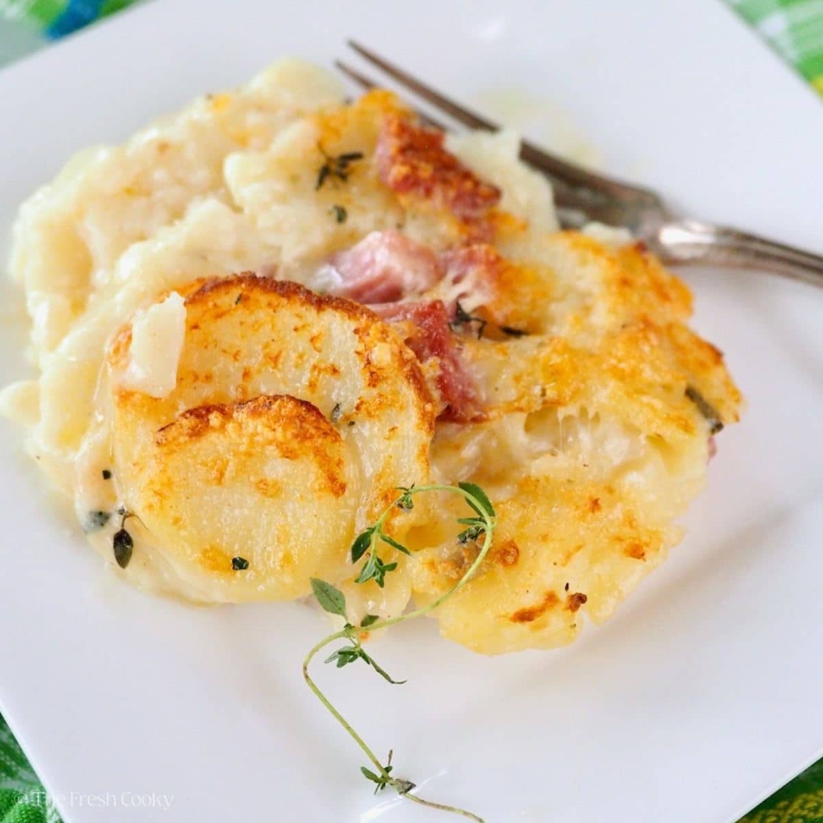 Instant Pot scalloped potatoes with ham on a serving plate.