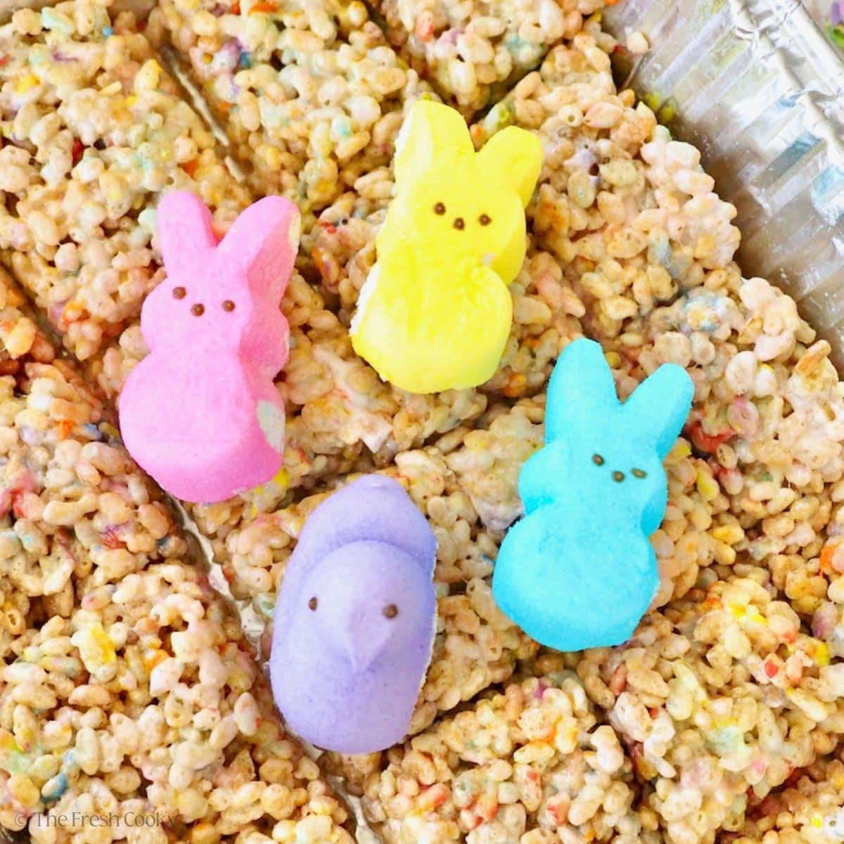 Four peeps on top of rice krispy treats, made with peeps.