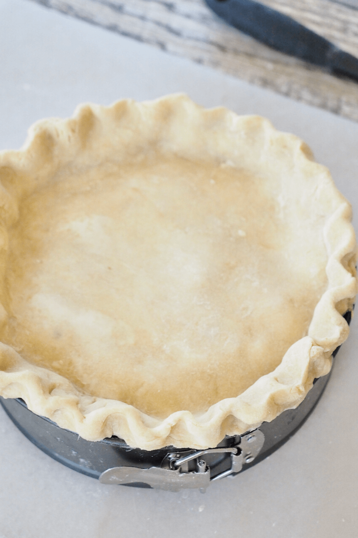 Top piece of dough laid on top and pinched to meat bottom crust.