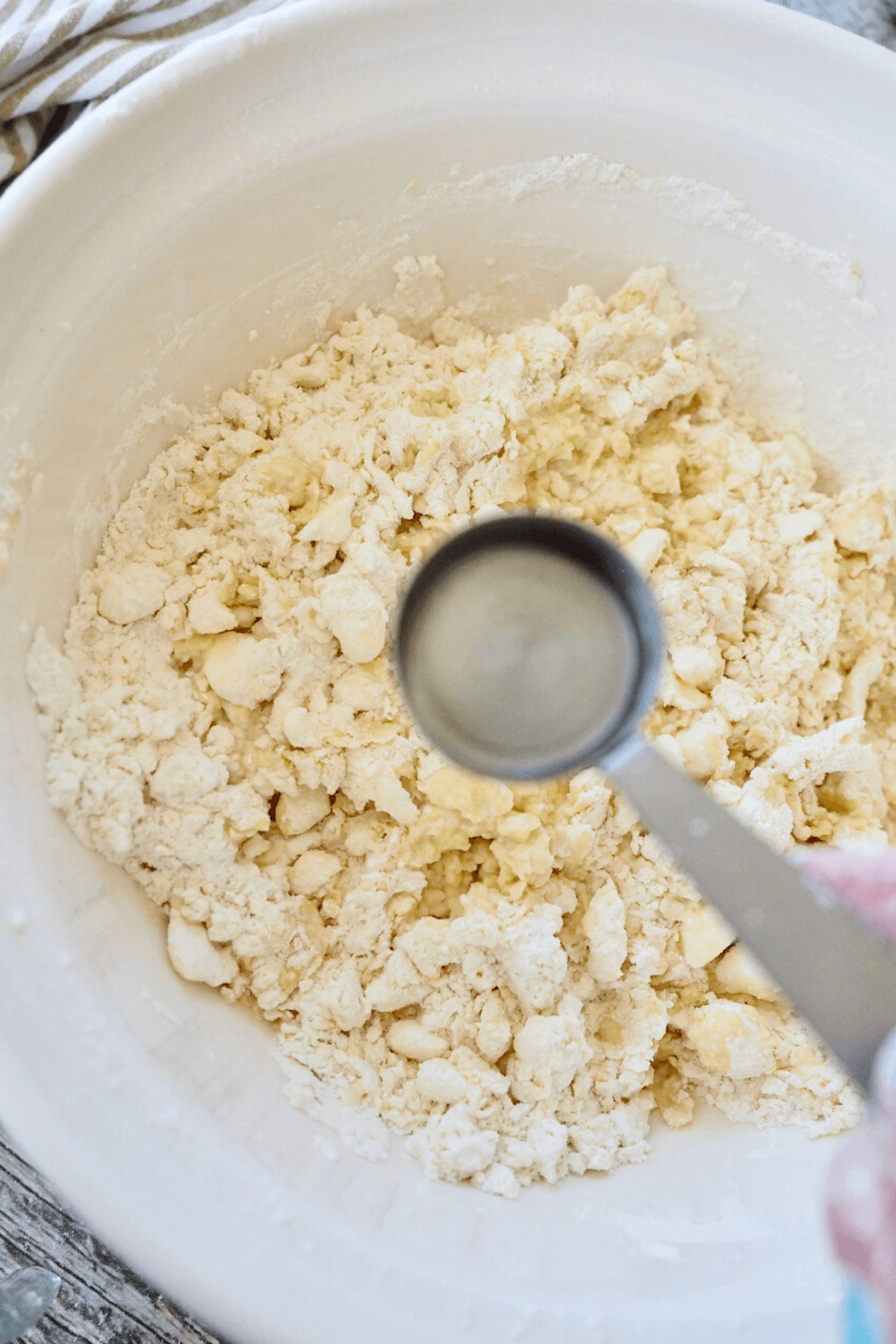 Add ice water to dough, knead until it comes together. 