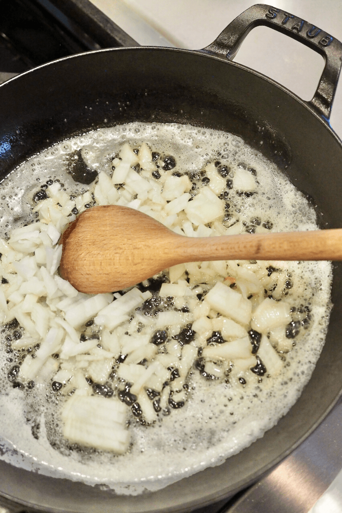 Butter and onions browning in skillet. 