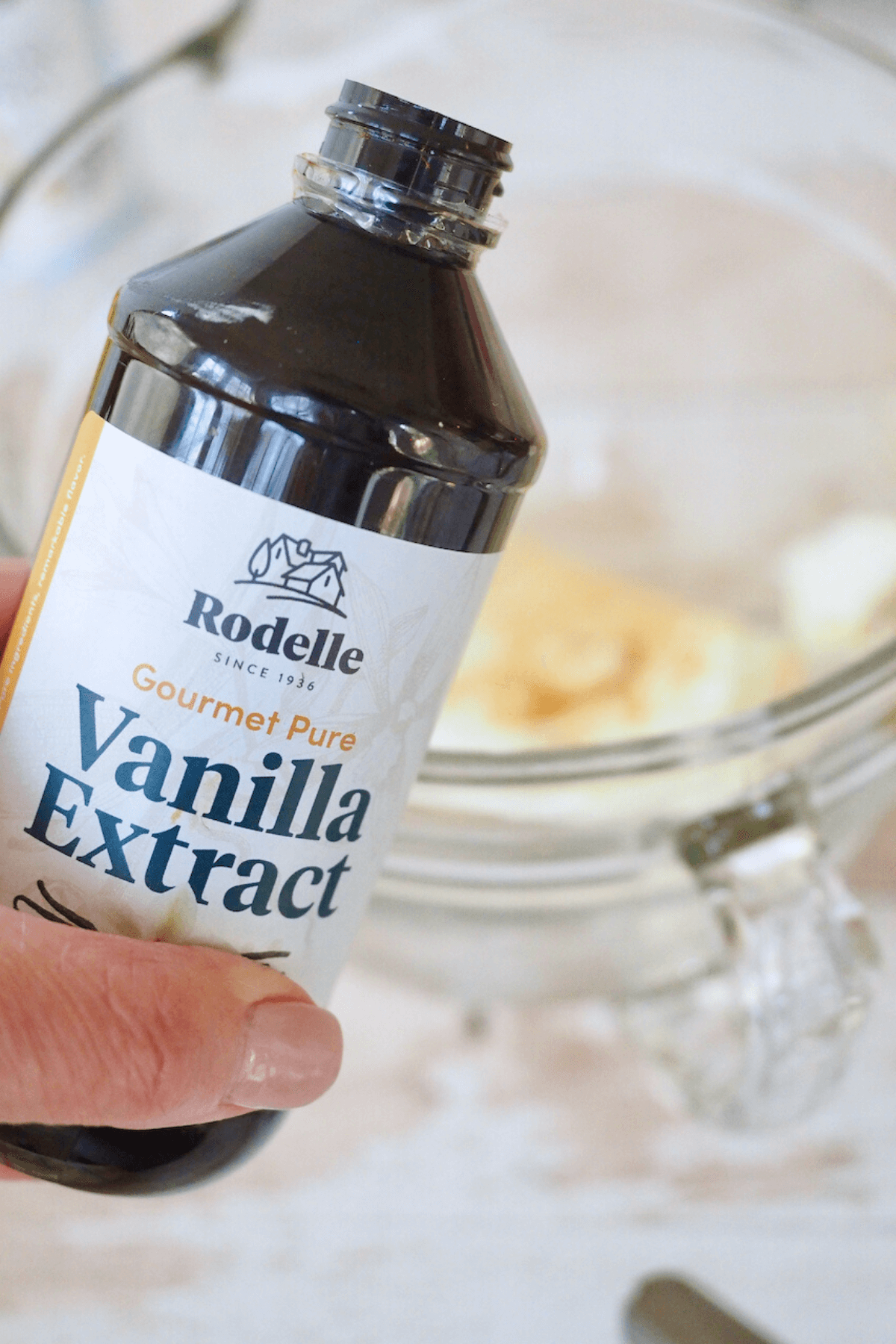 Adding Rodelle vanilla to cream cheese mixture for lemon dump cake recipe. 
