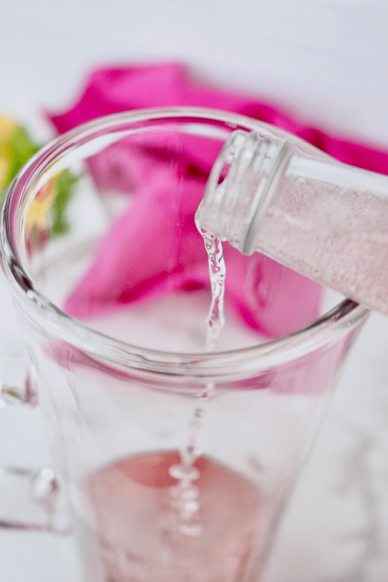 Pour sparkling beverage over other juices for pink lemonade vodka punch. 