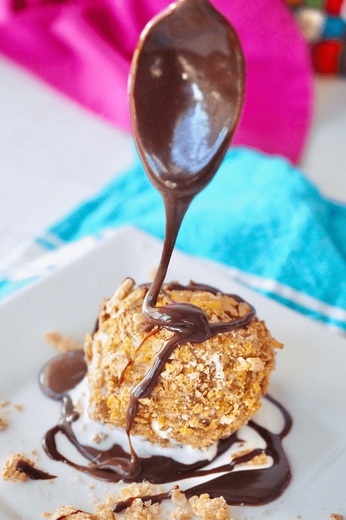 Drizzle on hot fudge onto an air fryer fried ice cream ball.