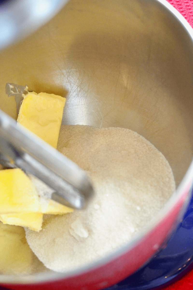 Cream  butter and sugar in mixer well. 