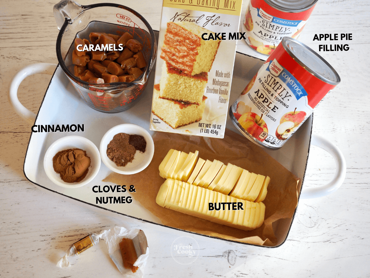 Labeled Ingredients for caramel apple dump cake in pan.
