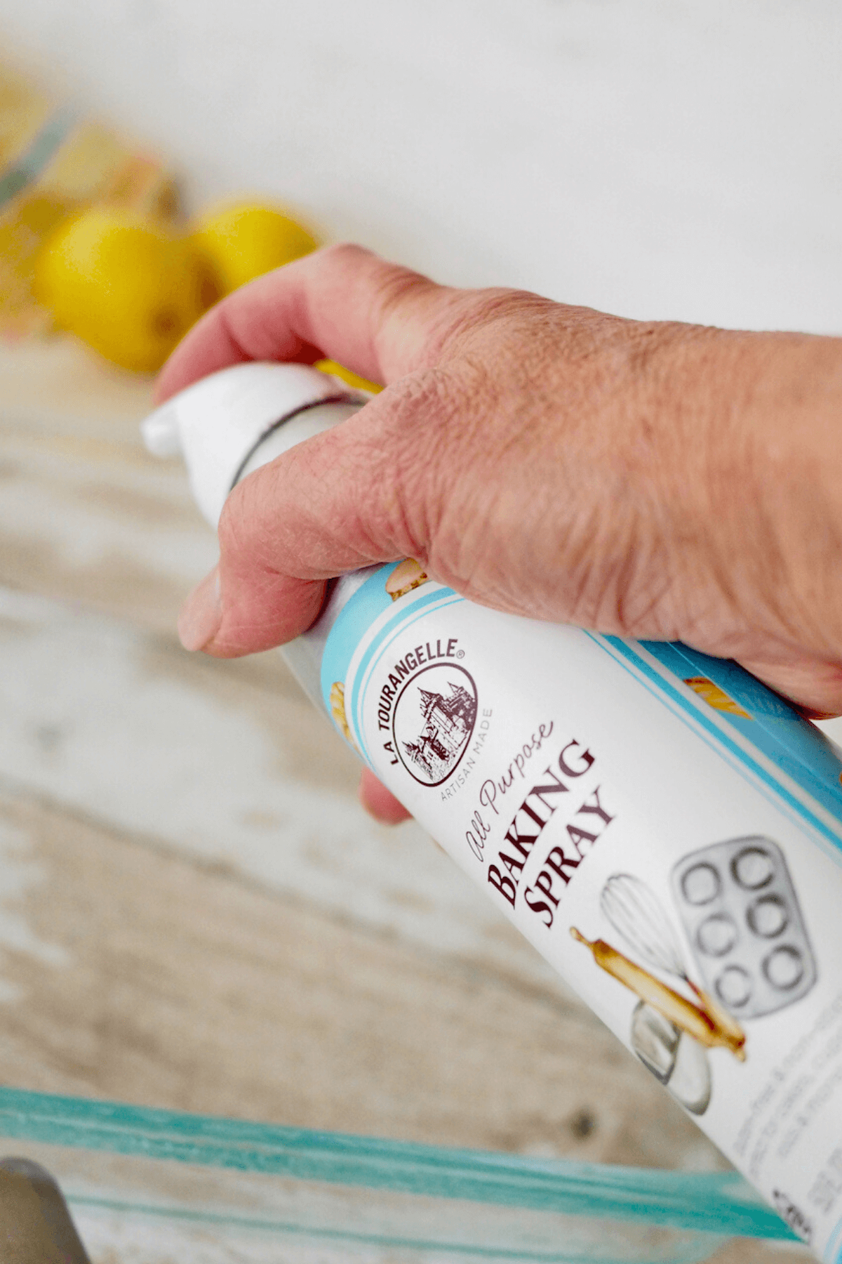 Spraying the baking pan with la tourangelle baking spray.