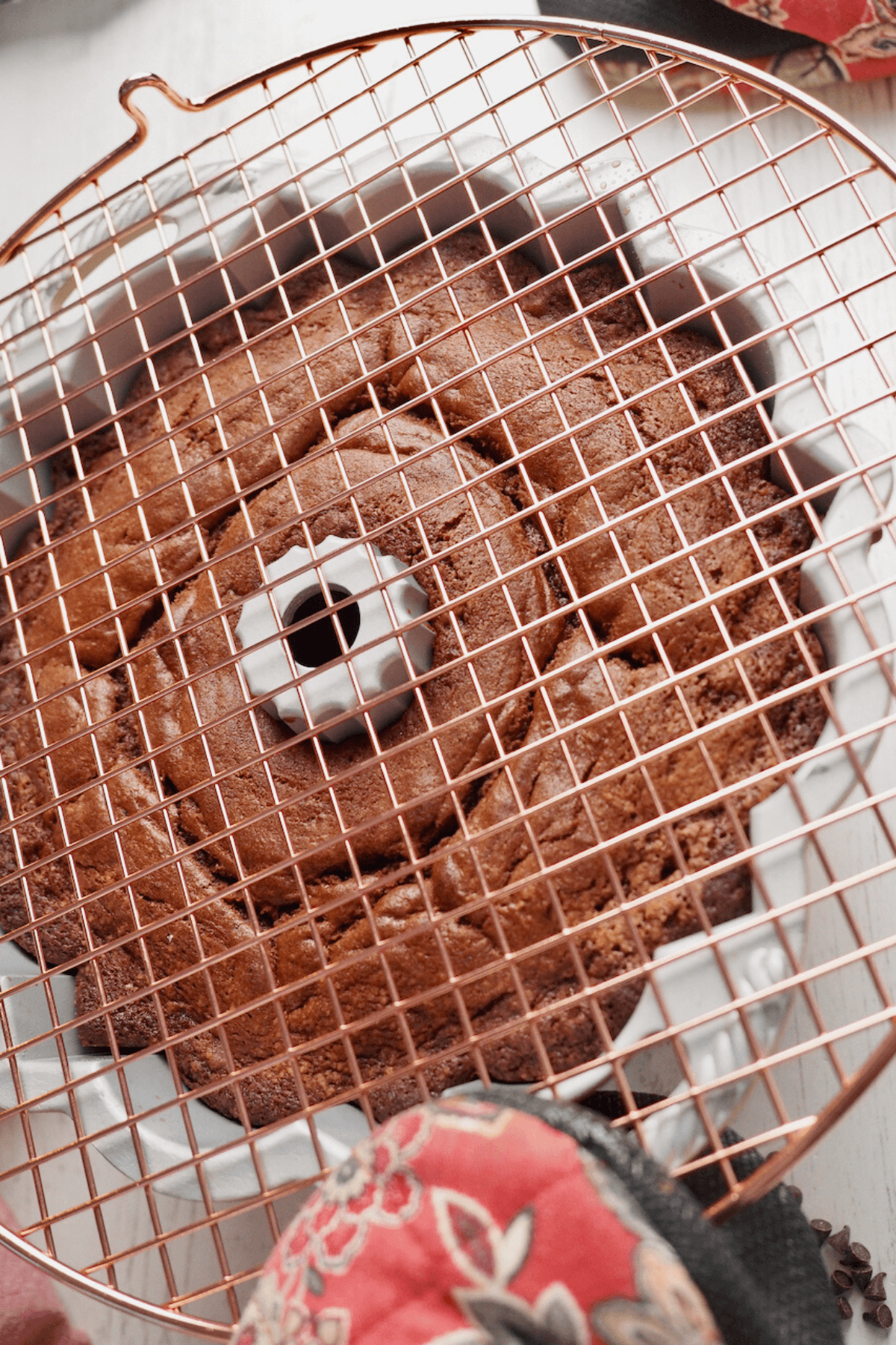 Placing cooling rack on top of bundt and inverting onto cooling rack. 