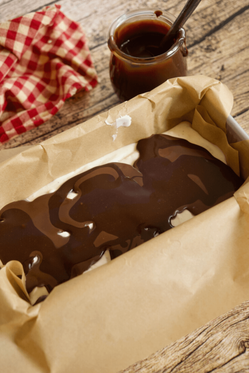 Added magic shell and hot fudge sauce over vanilla ice cream base for Moose Tracks.