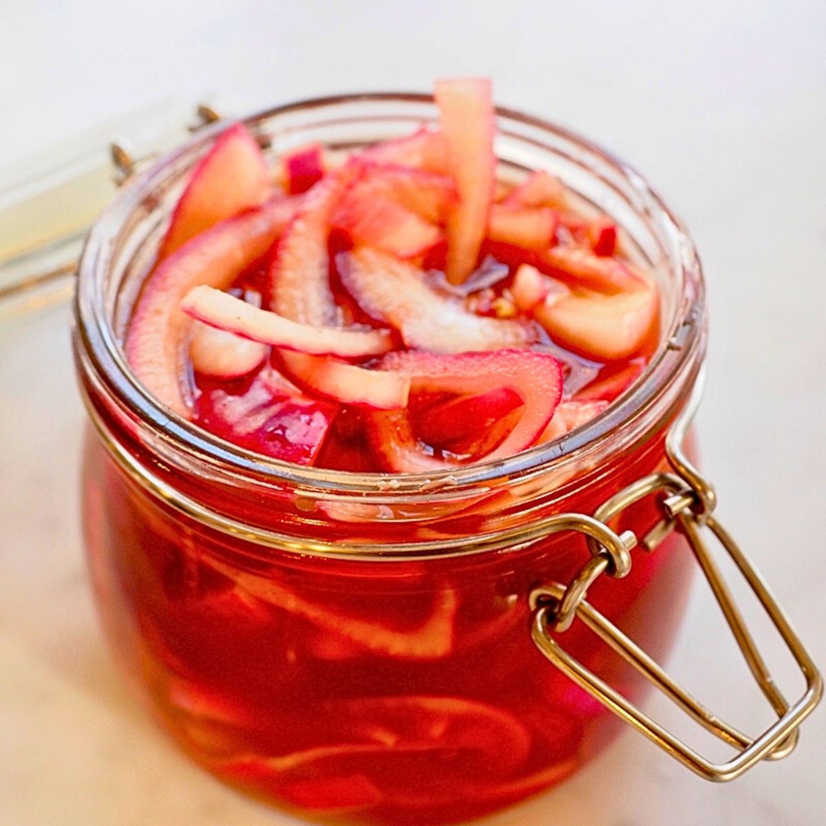 Panera pickled onions freshly brined placed into storage jar.