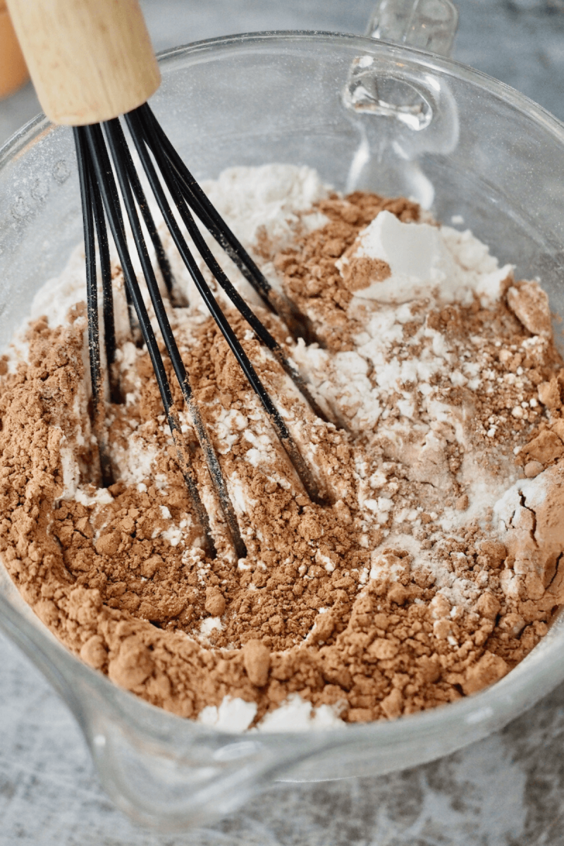 Whisking dry ingredients together for red velvet cake.