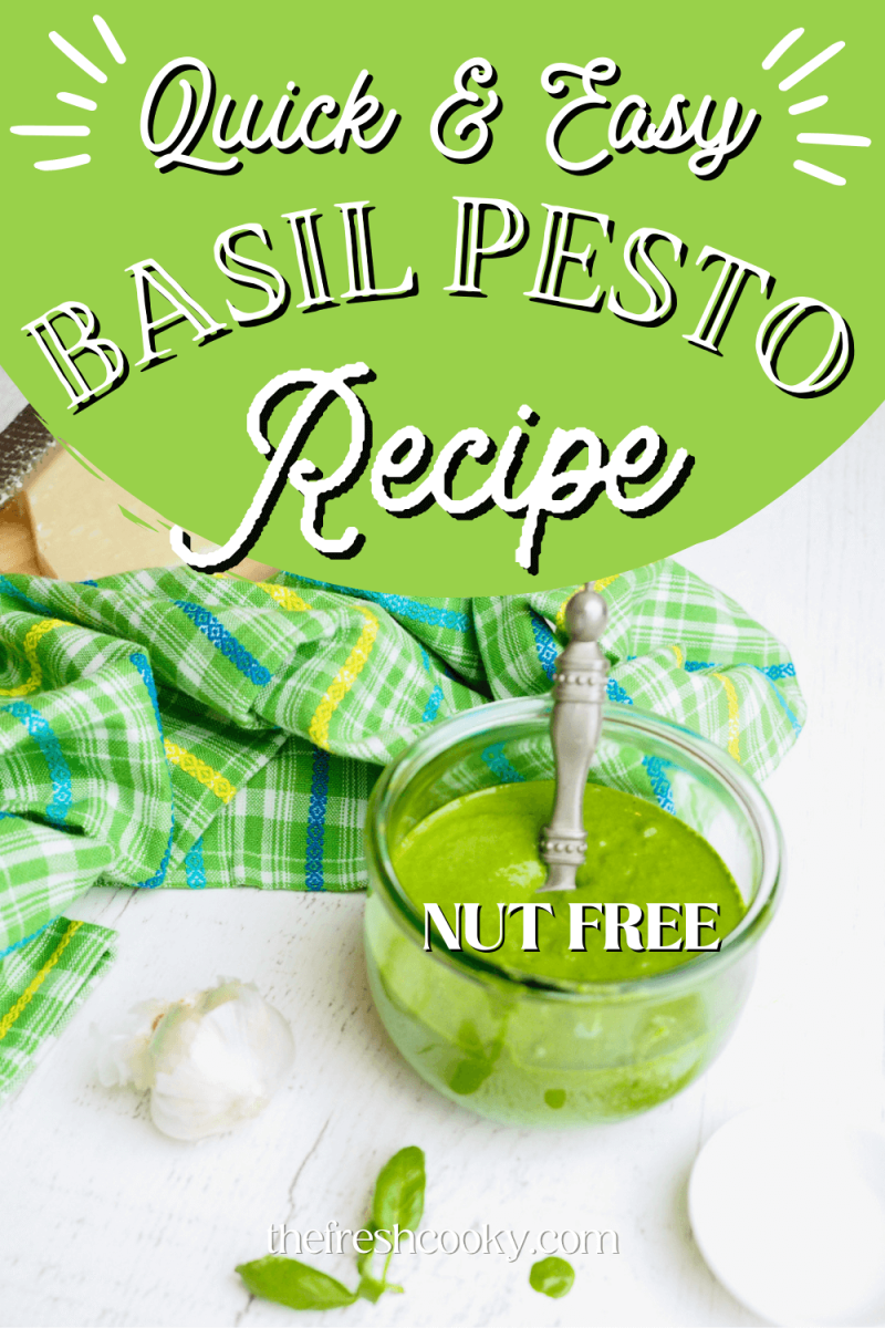 Quick and Easy Basil Pesto Recipe pin with image of pretty jar of spinach basil pesto with a spoon inside, fresh garlic and basil nearby and parmesan cheese in background.
