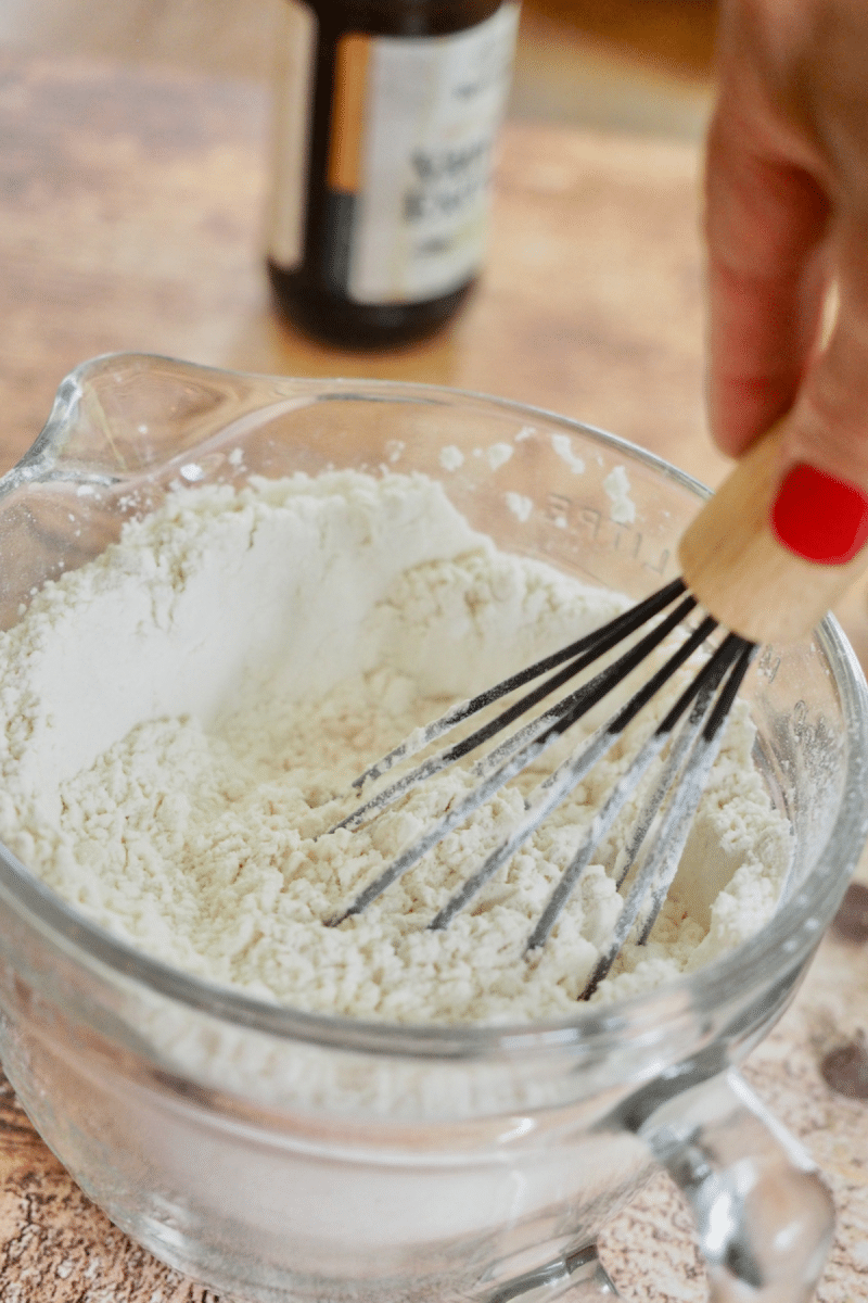 Whisking dry ingredients together for chocolate chip crumbl cookies. 