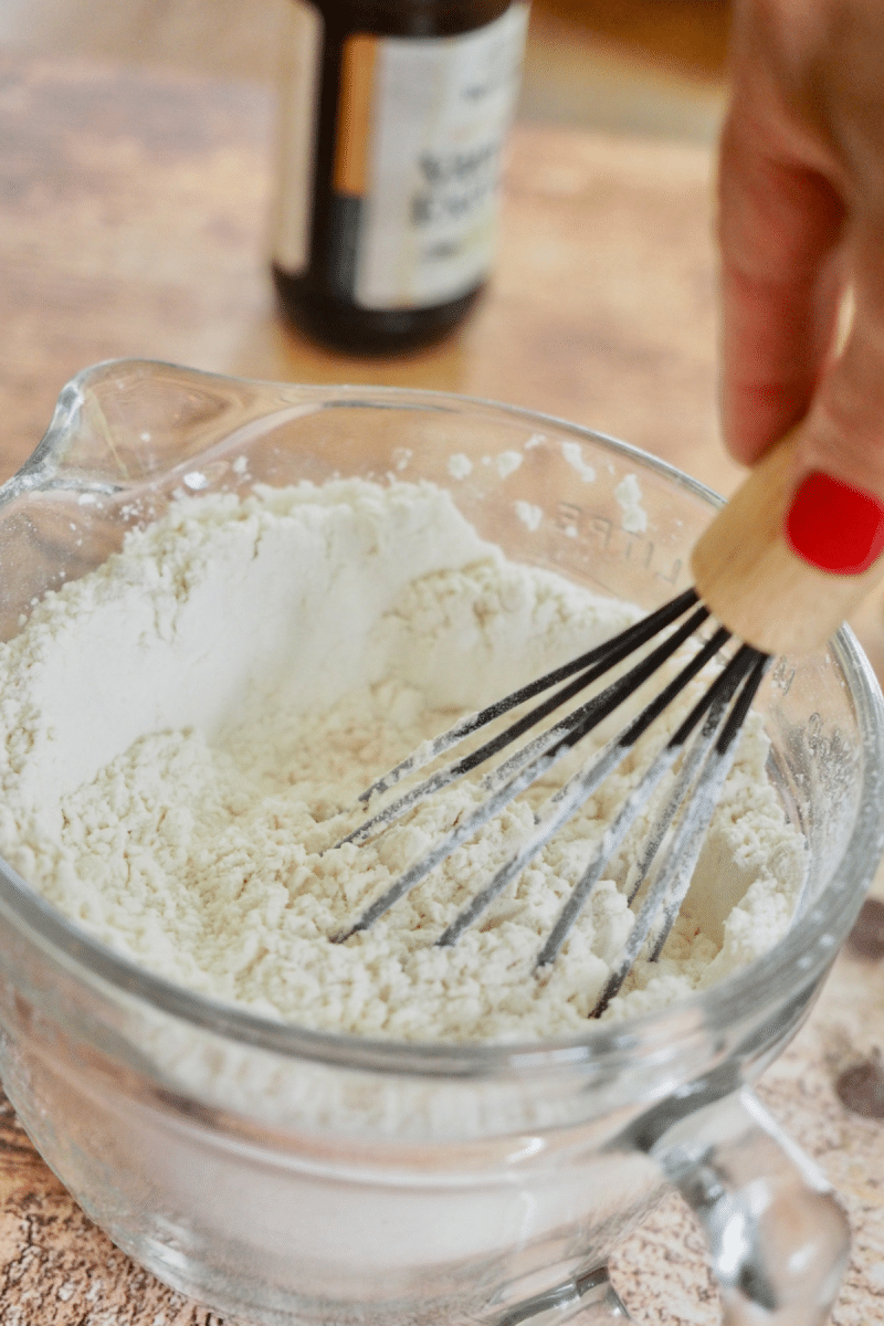 Whisking dry ingredients together for chocolate chip crumbl cookies.