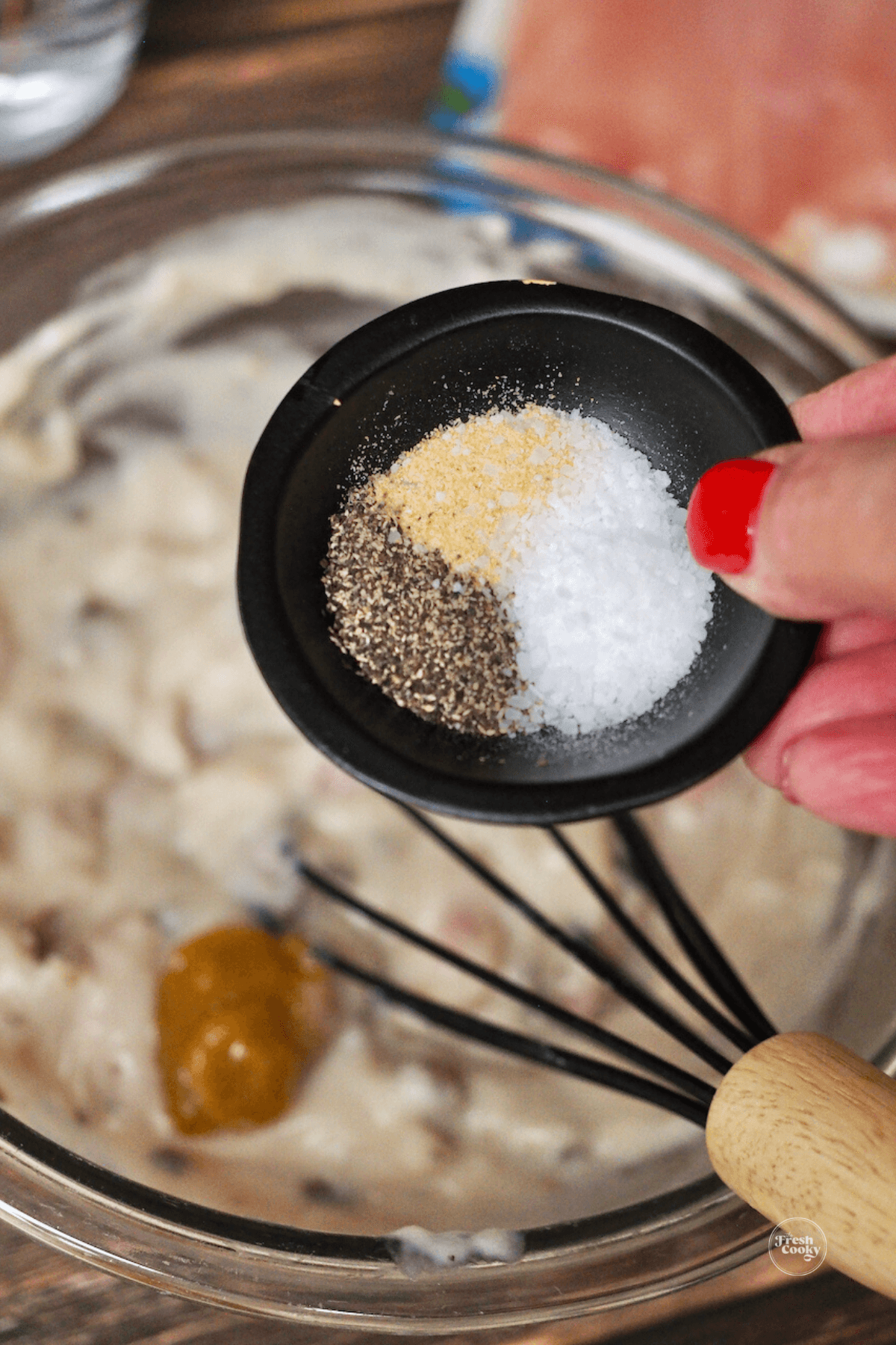 Add salt, pepper and garlic to cream of mushroom soup mixture. 