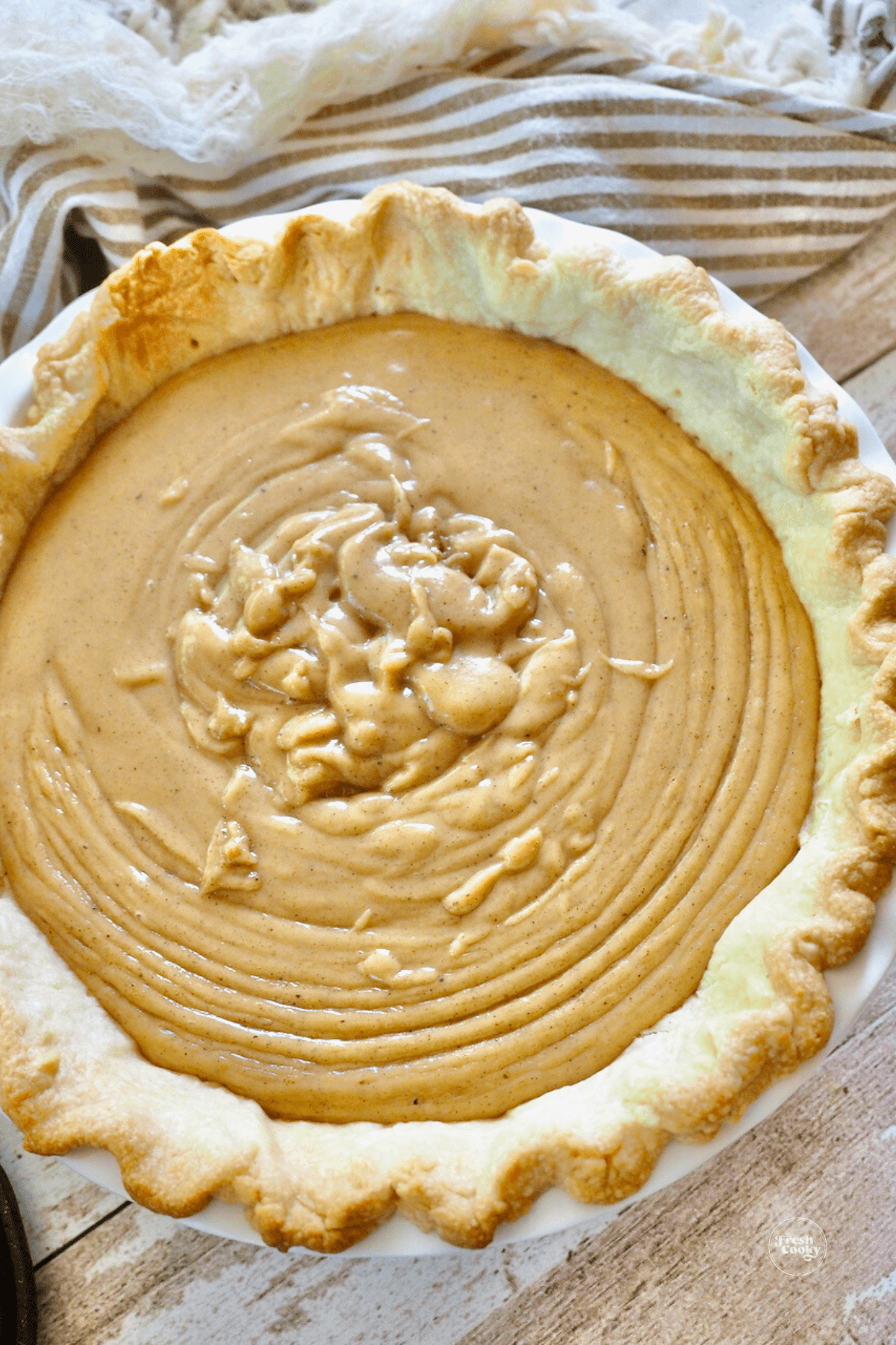Freshly poured in butterscotch cinnamon pie in baked pie shell. 