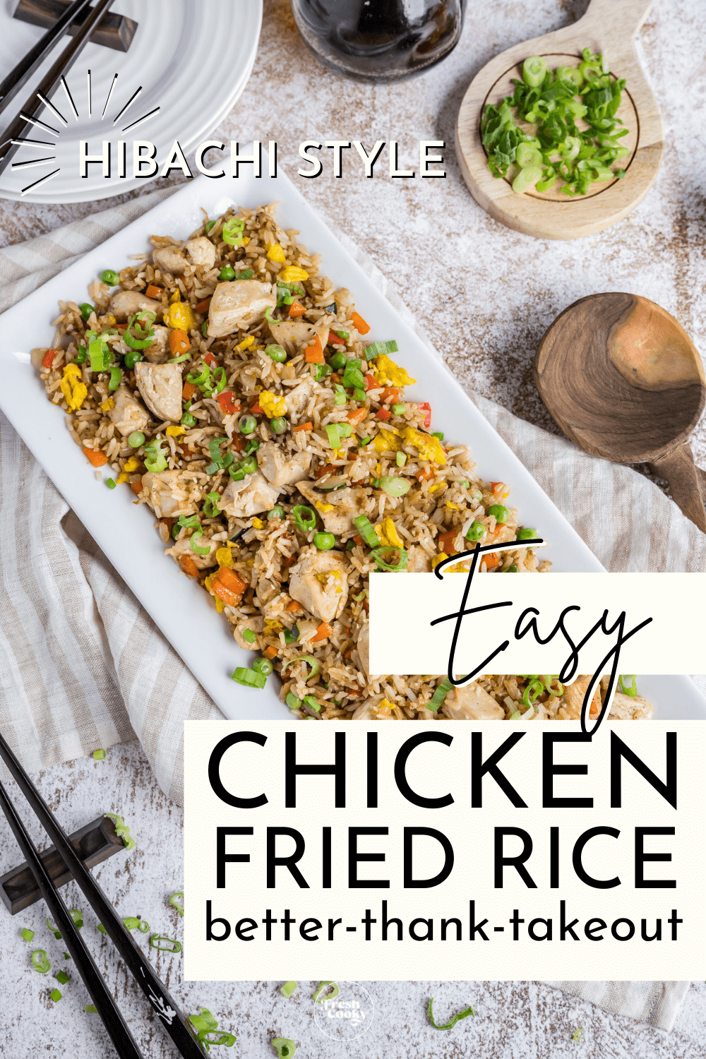 Blackstone Chicken Fried Rice pin, better than takeout and easy too with platter of rice, green onions, chopsticks and a wooden spoon nearby.