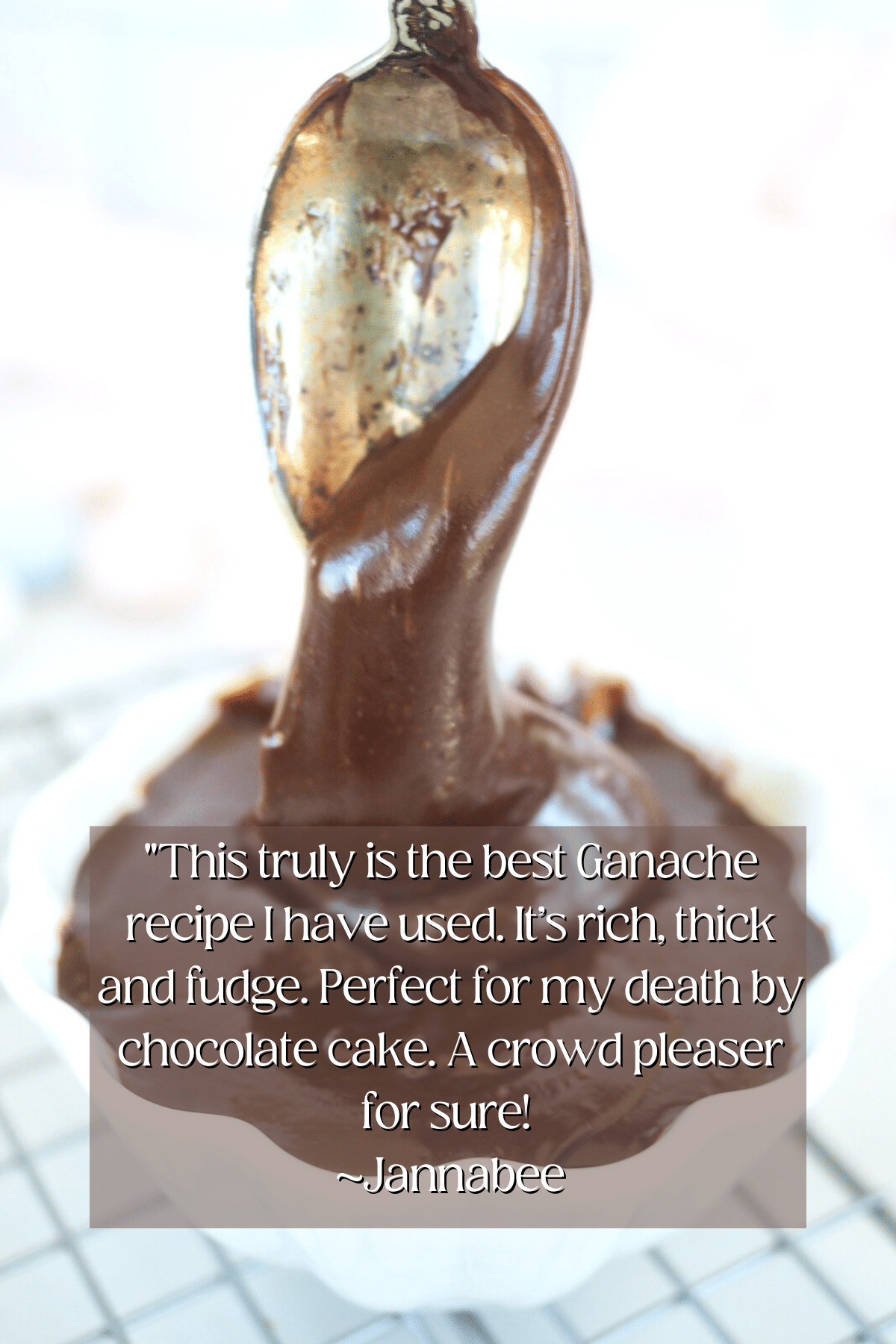 Image of spoon dripping with thick chocolate ganache. 