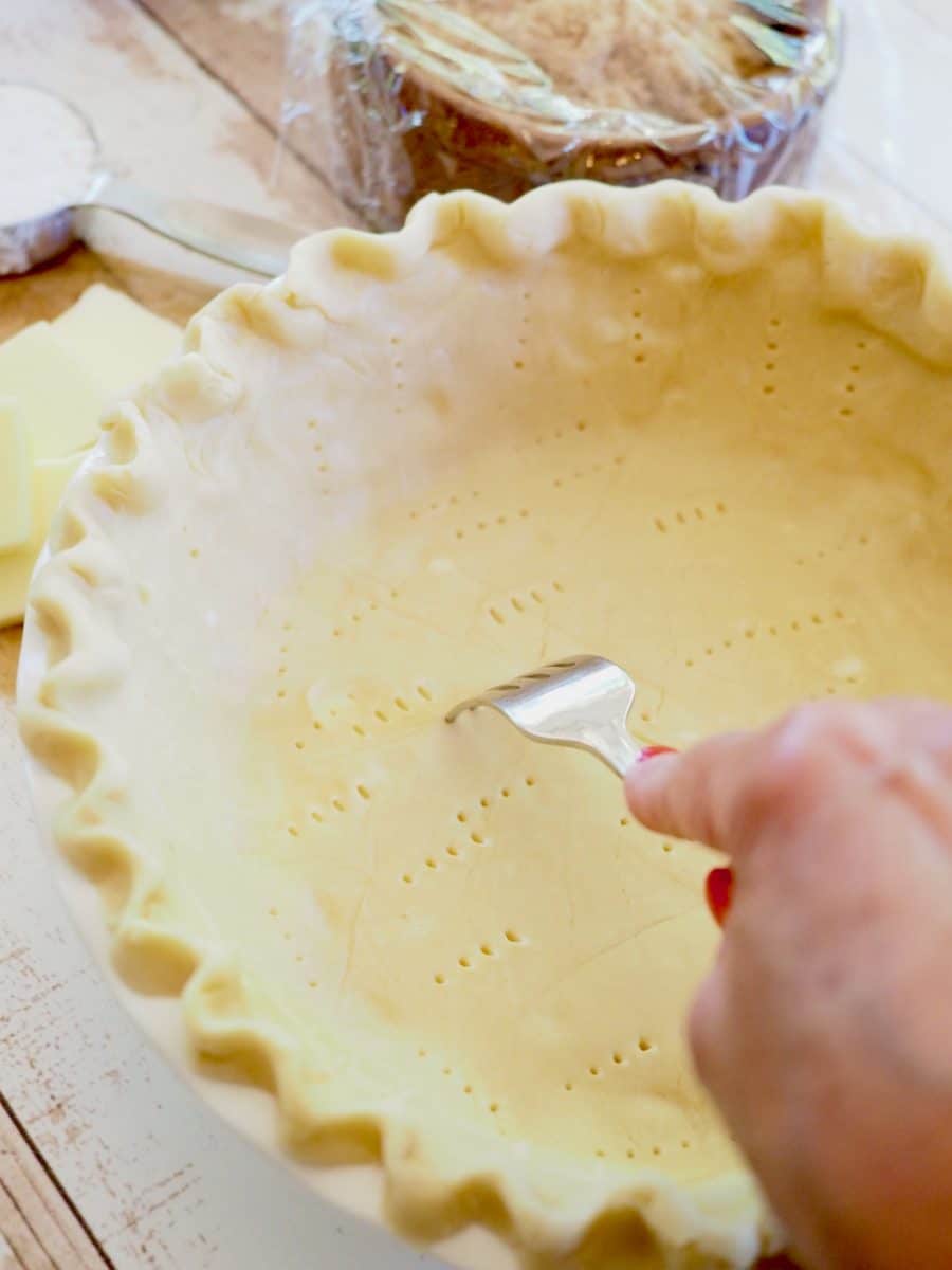 Poke holes in pie dough all over.