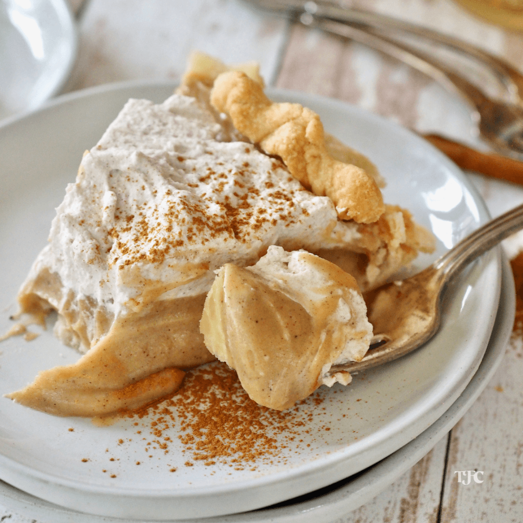 Butterscotch Cinnamon Pie slice on a plate with bite on a fork.