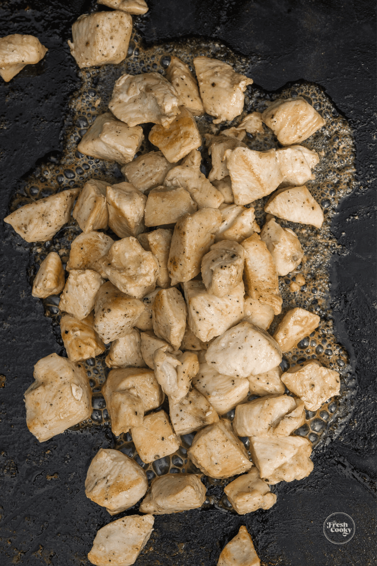 Cooking chicken breast on blackstone griddle with a little salt and pepper.