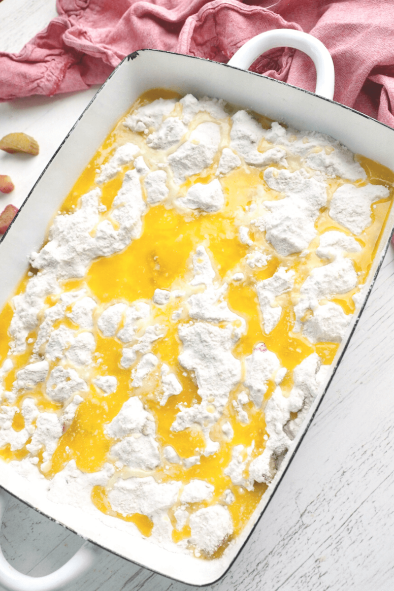 Butter poured over dump cake ready for oven.
