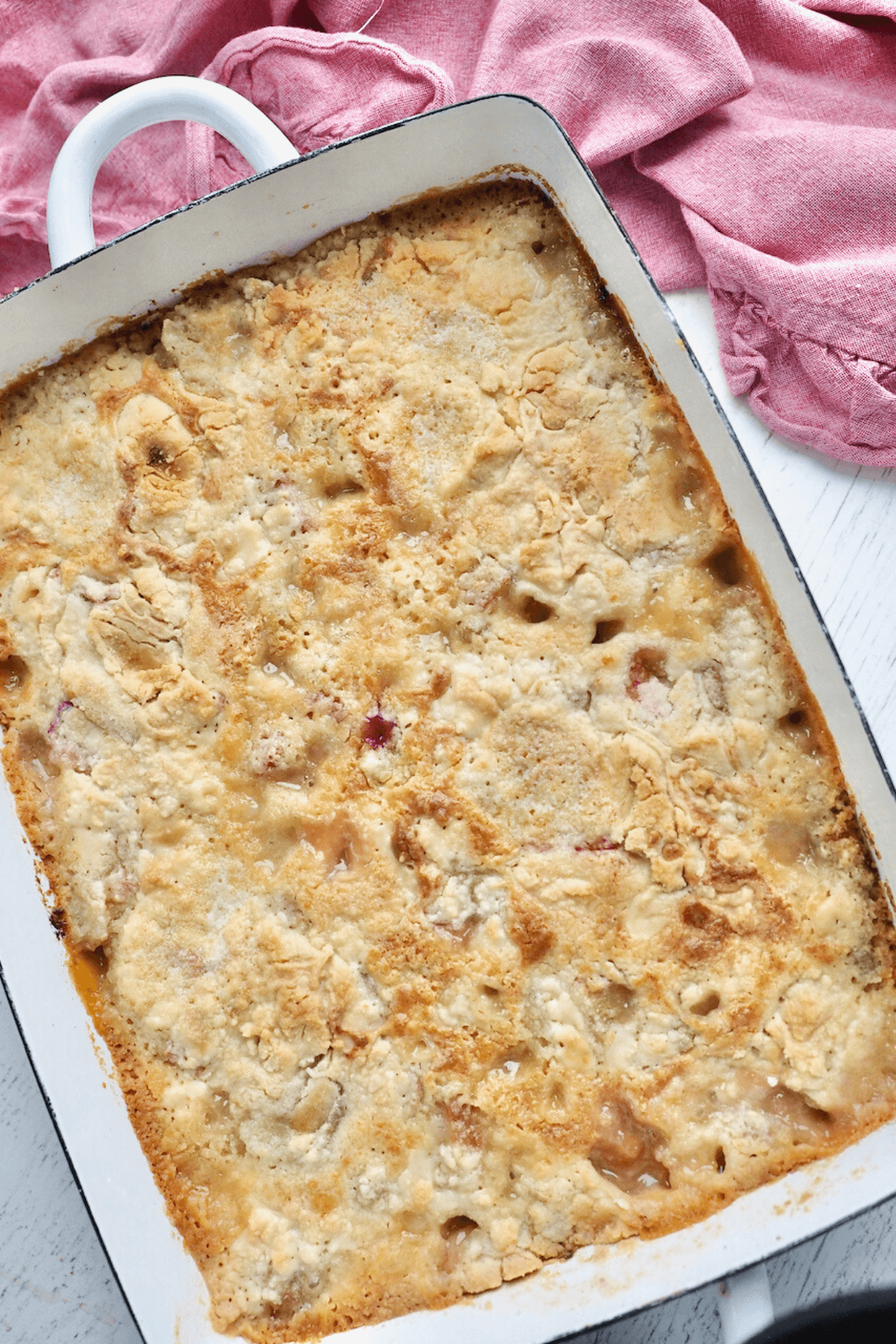 Rhubarb Dump Cake in pan golden and bubbly.