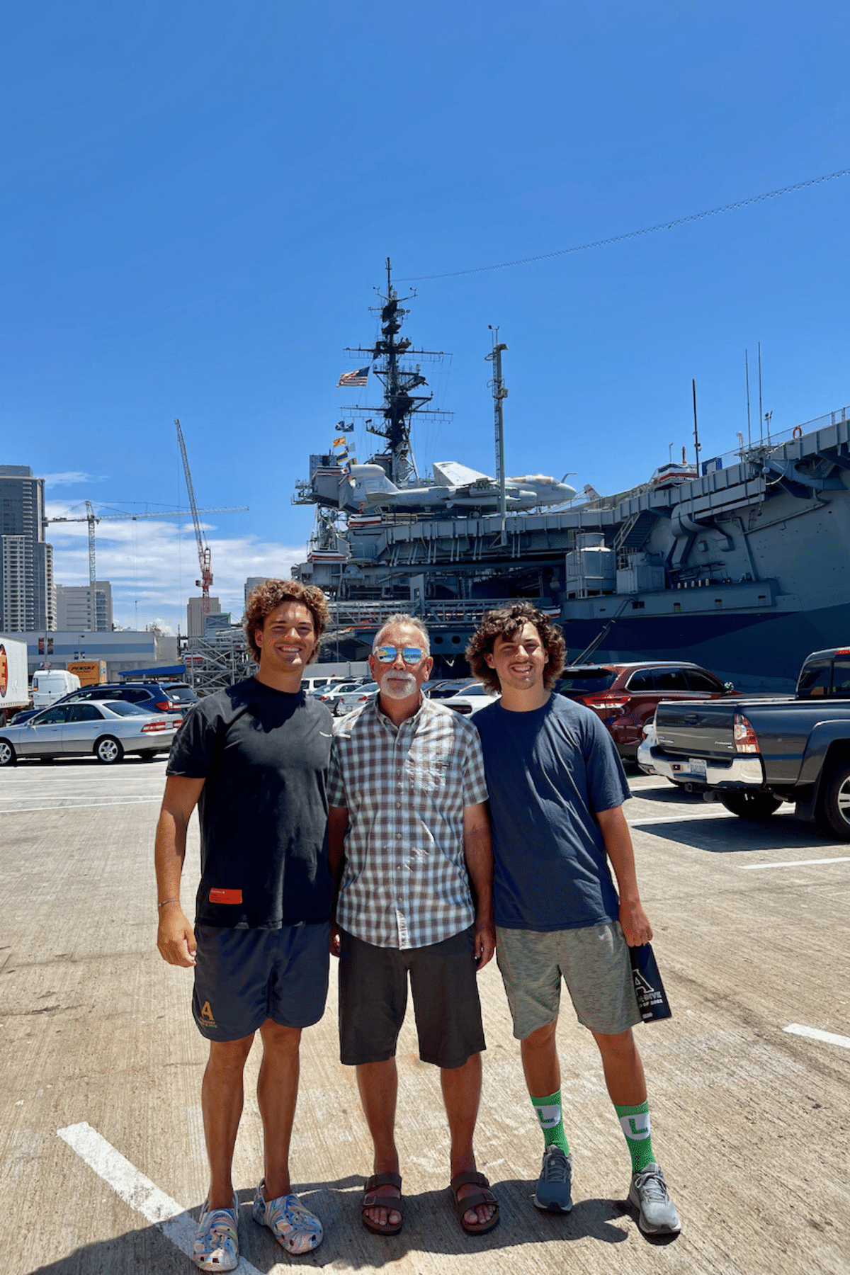 Husband and boys in front of the USS Midway in San Diego. 