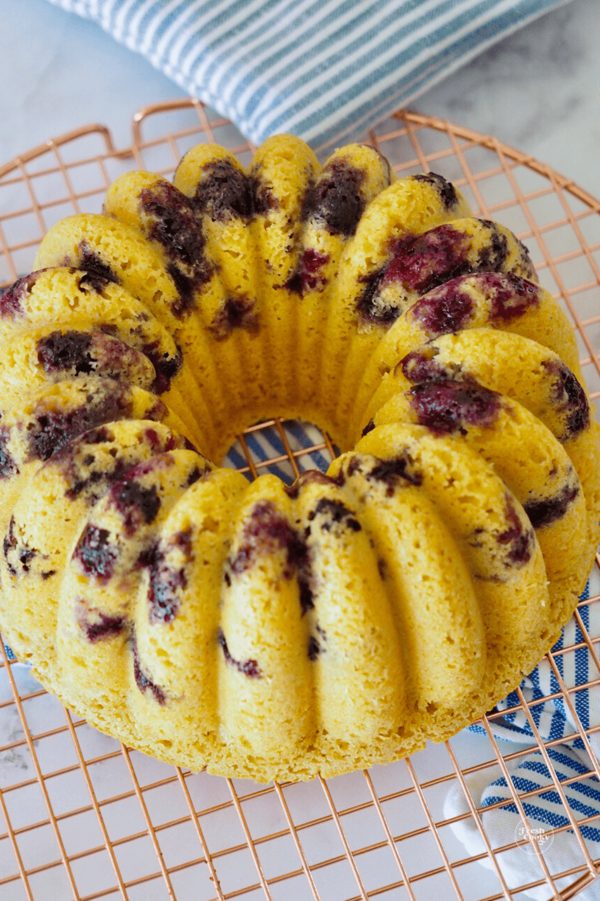 Blueberry Pancake Bundt Cake recipe on cooling rack.