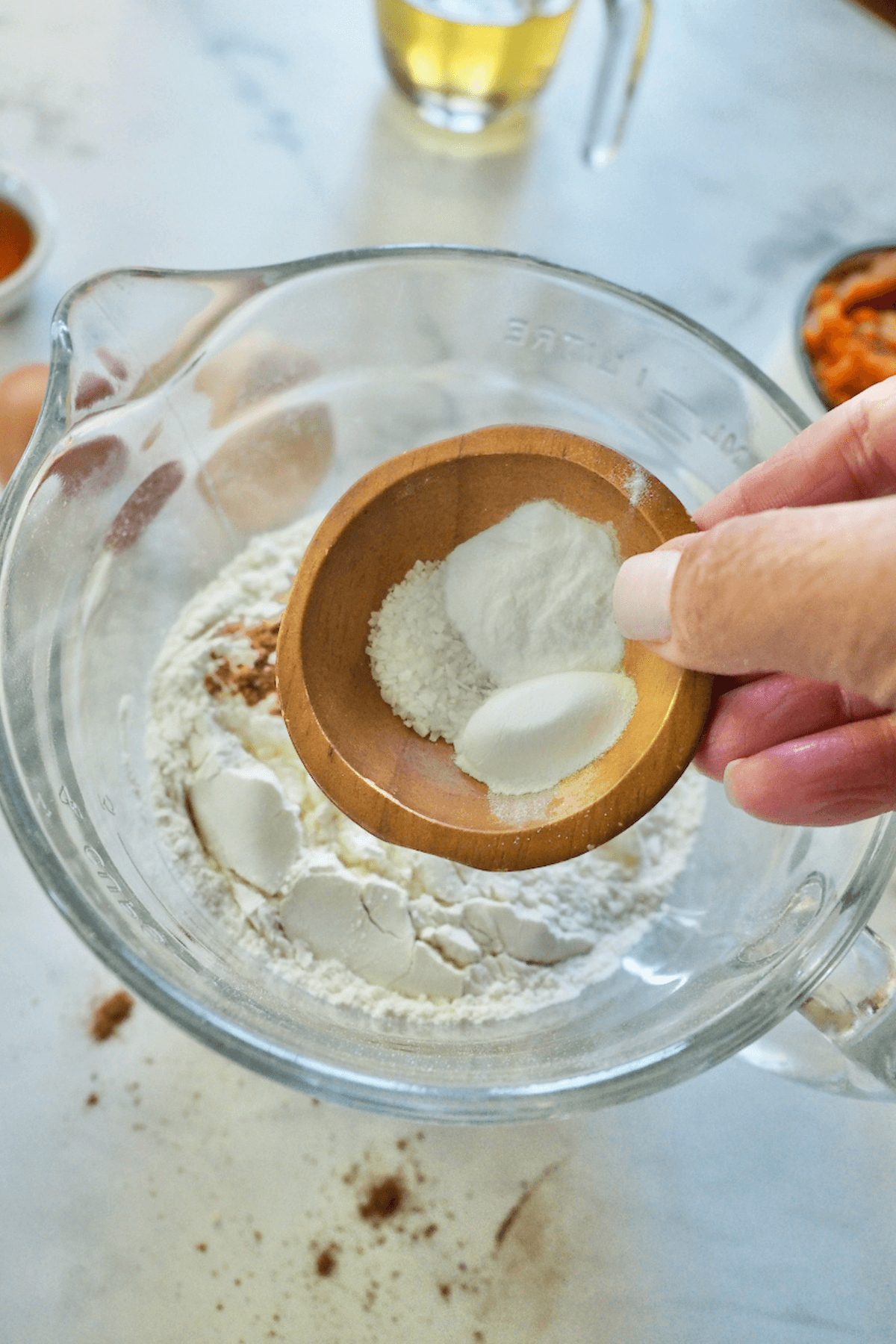 Adding salt, baking soda and baking powder to flour mixture.