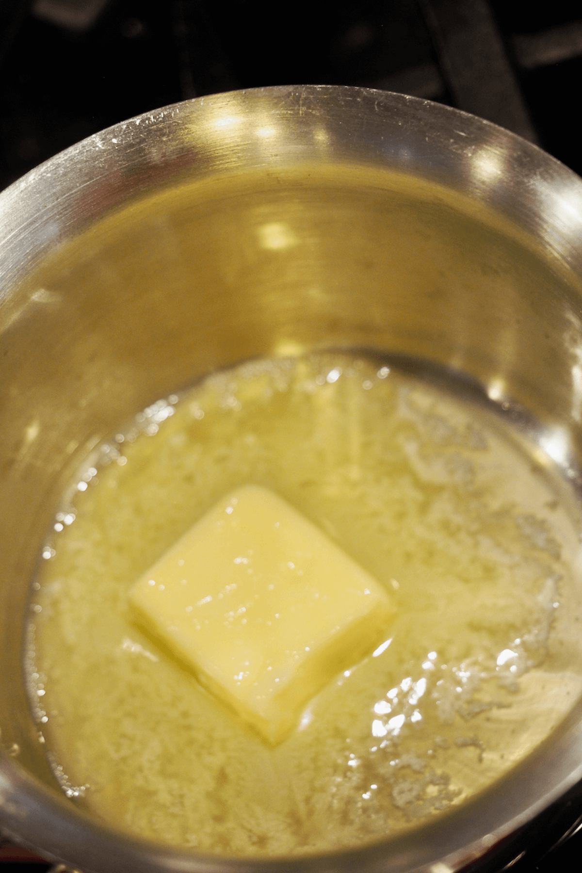 Melting butter in small saucepan.