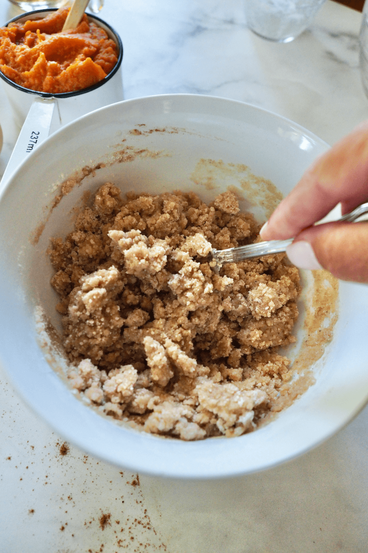 Crumb Topping being mixed in small bowl with fork. 