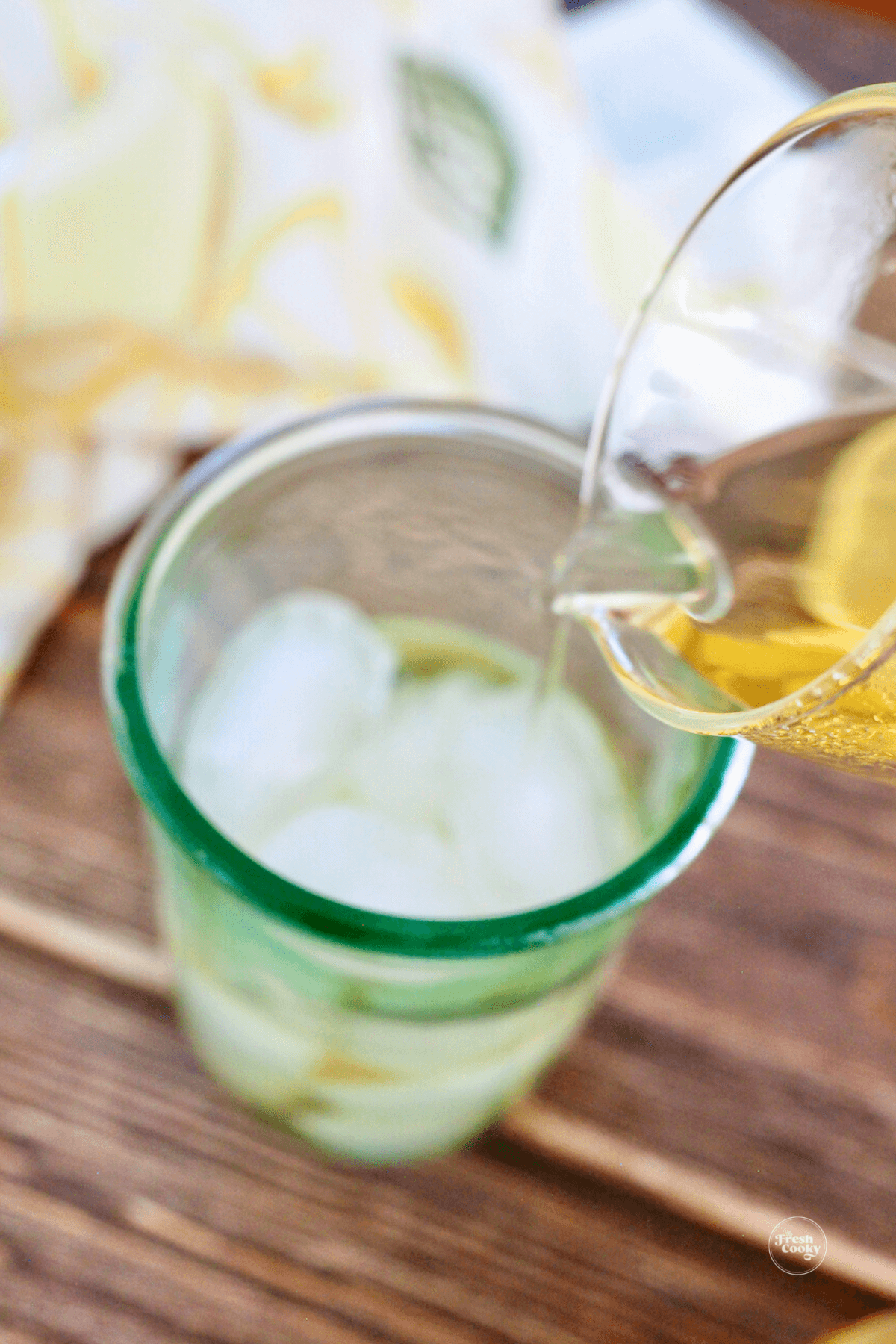 Pouring green tea over ice. 