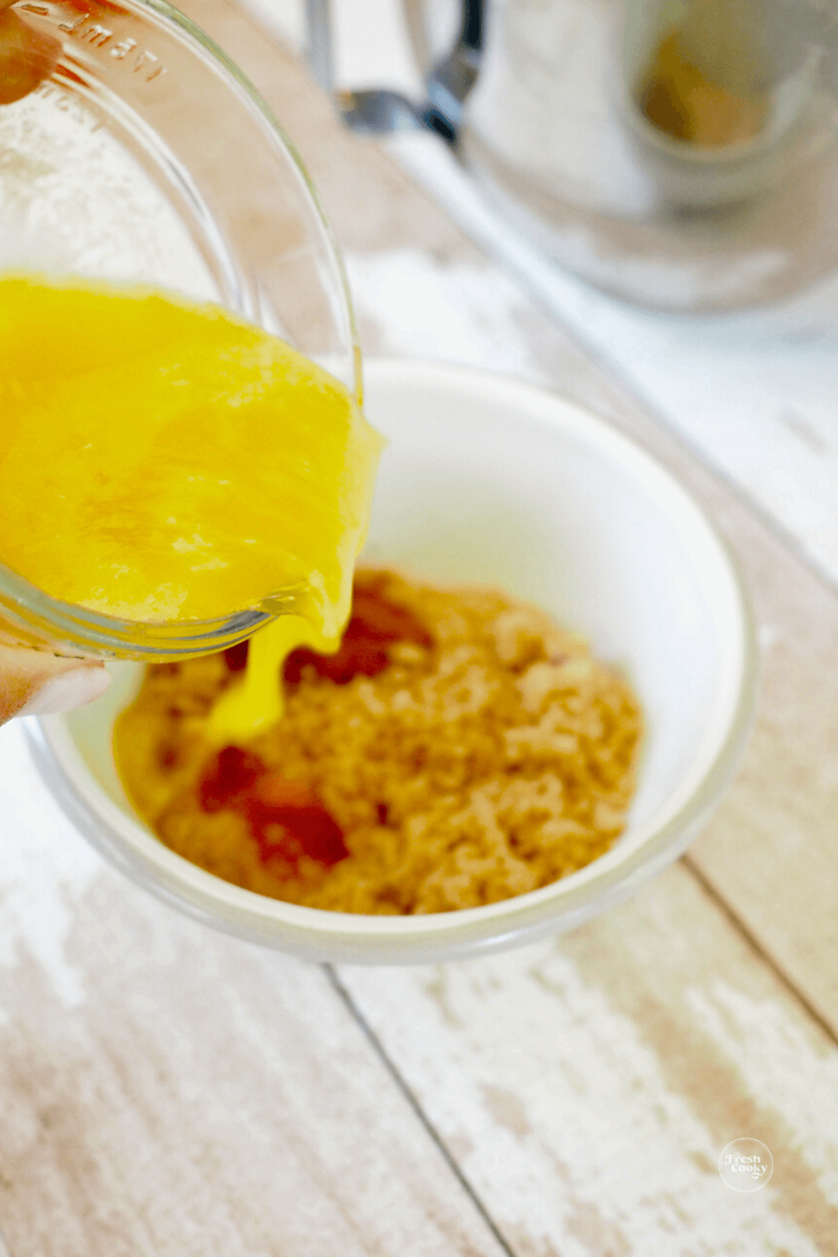 Mixing butter and brown sugar topping for cobbler mixture. 