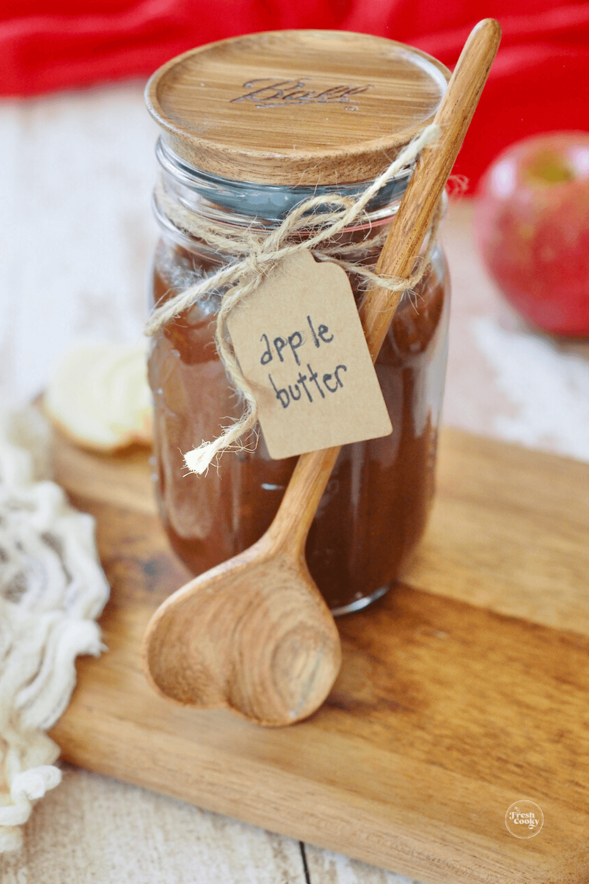 Jarred apple butter with label and cute spoon.