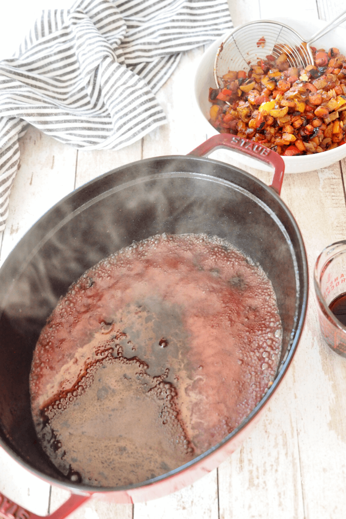 Deglazing pan with red wine. 