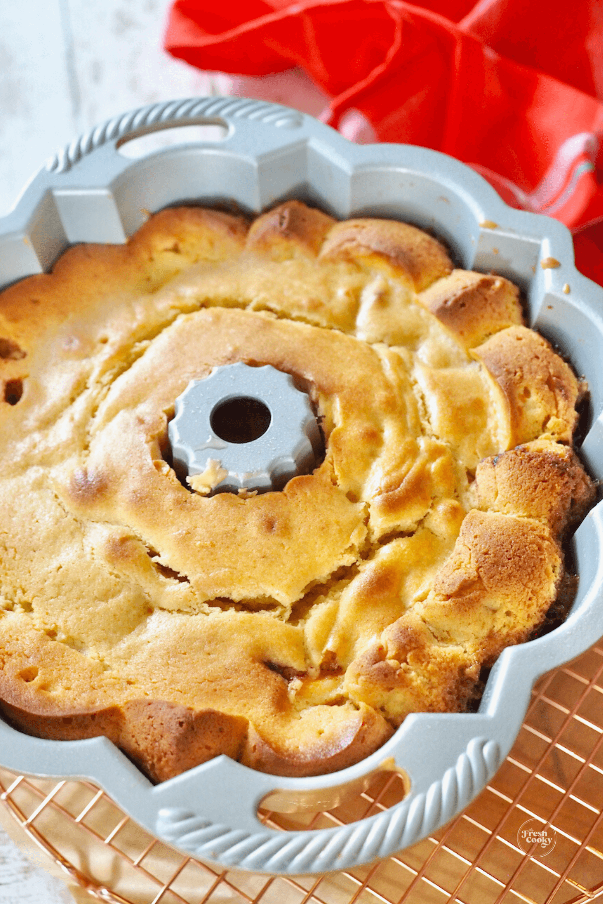 Cake cooling in pan on cooling rack. 