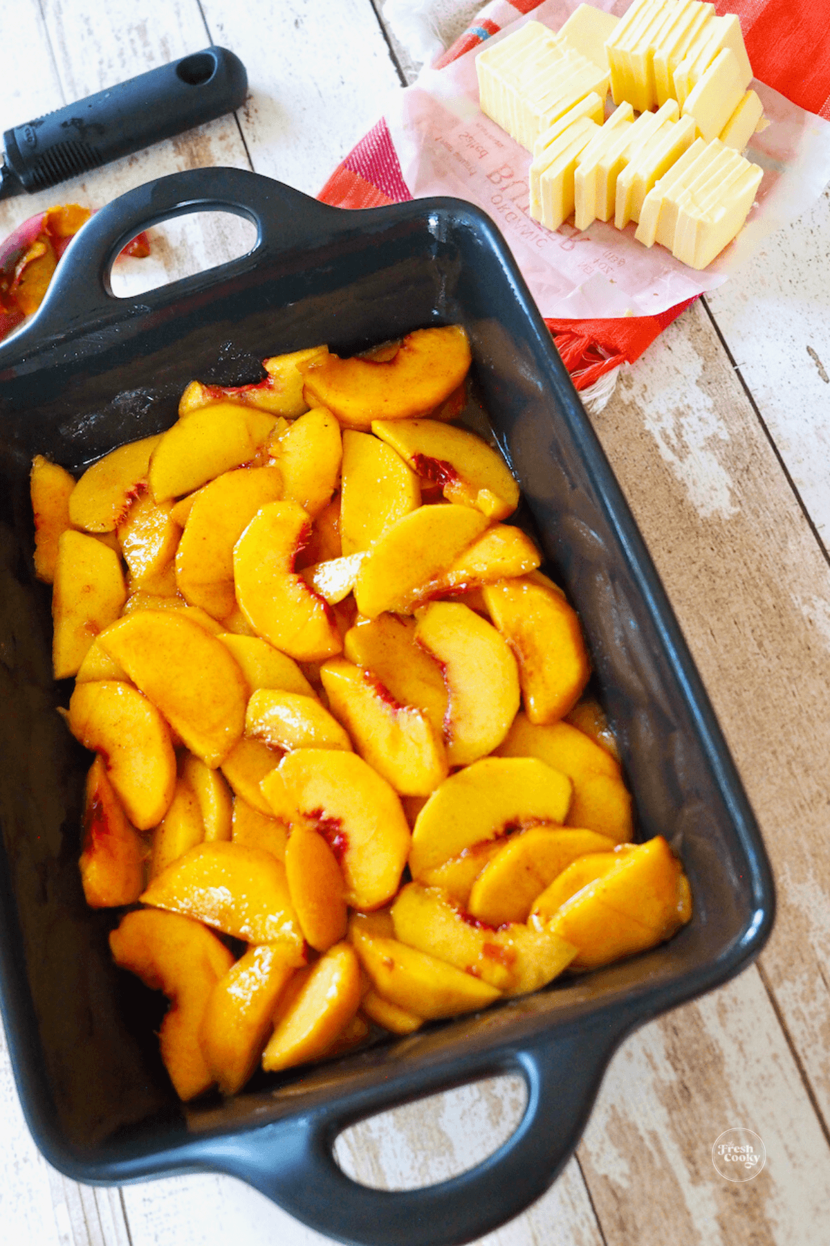 Peach mixture poured into prepared baking dish.