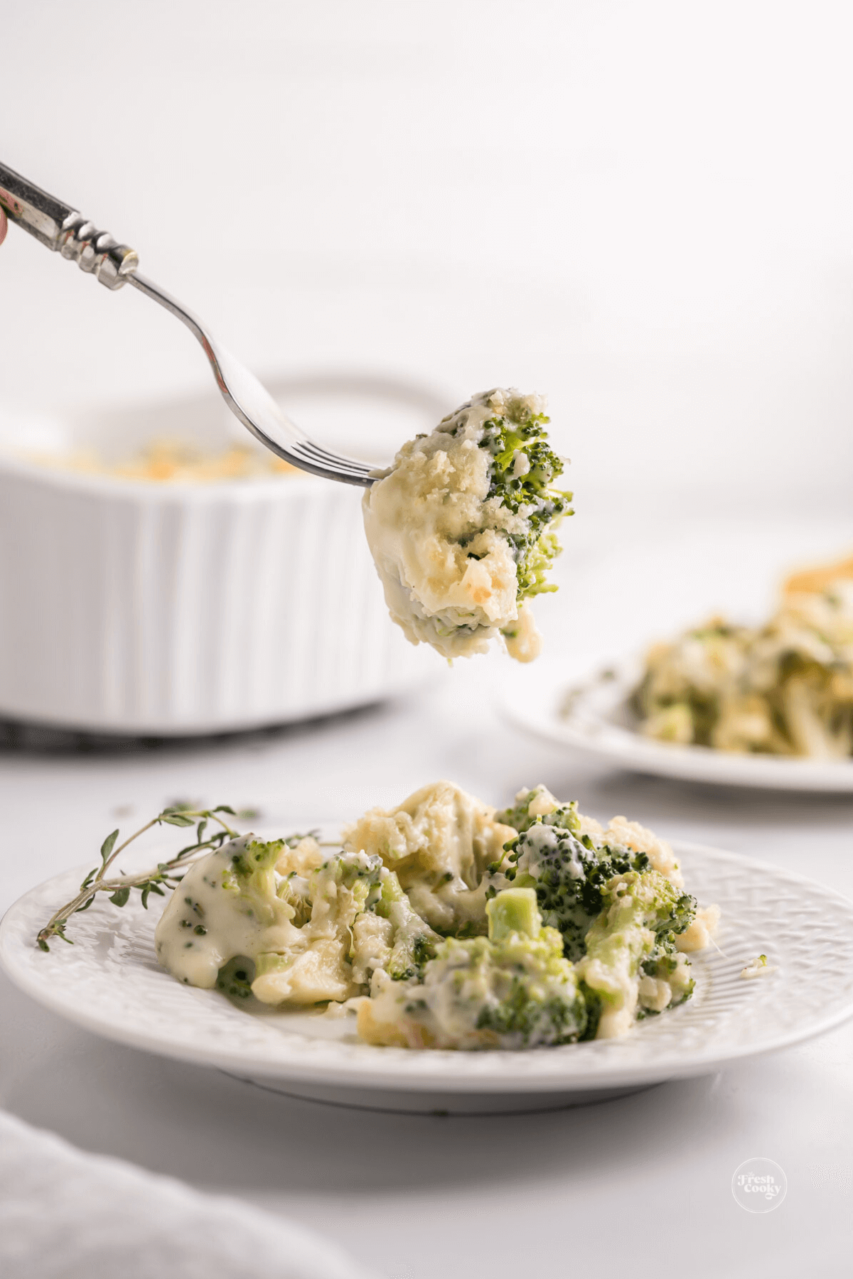 Taking a bite of broccoli au gratin.