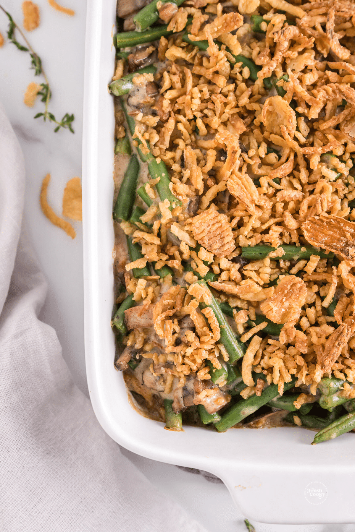 Green bean casserole with fried onions on top.