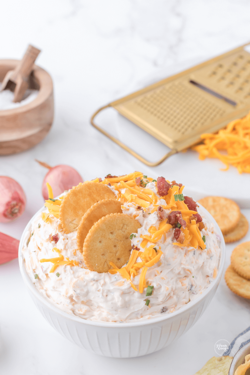 Ranch crack dip with crackers in the top of the creamy dip.