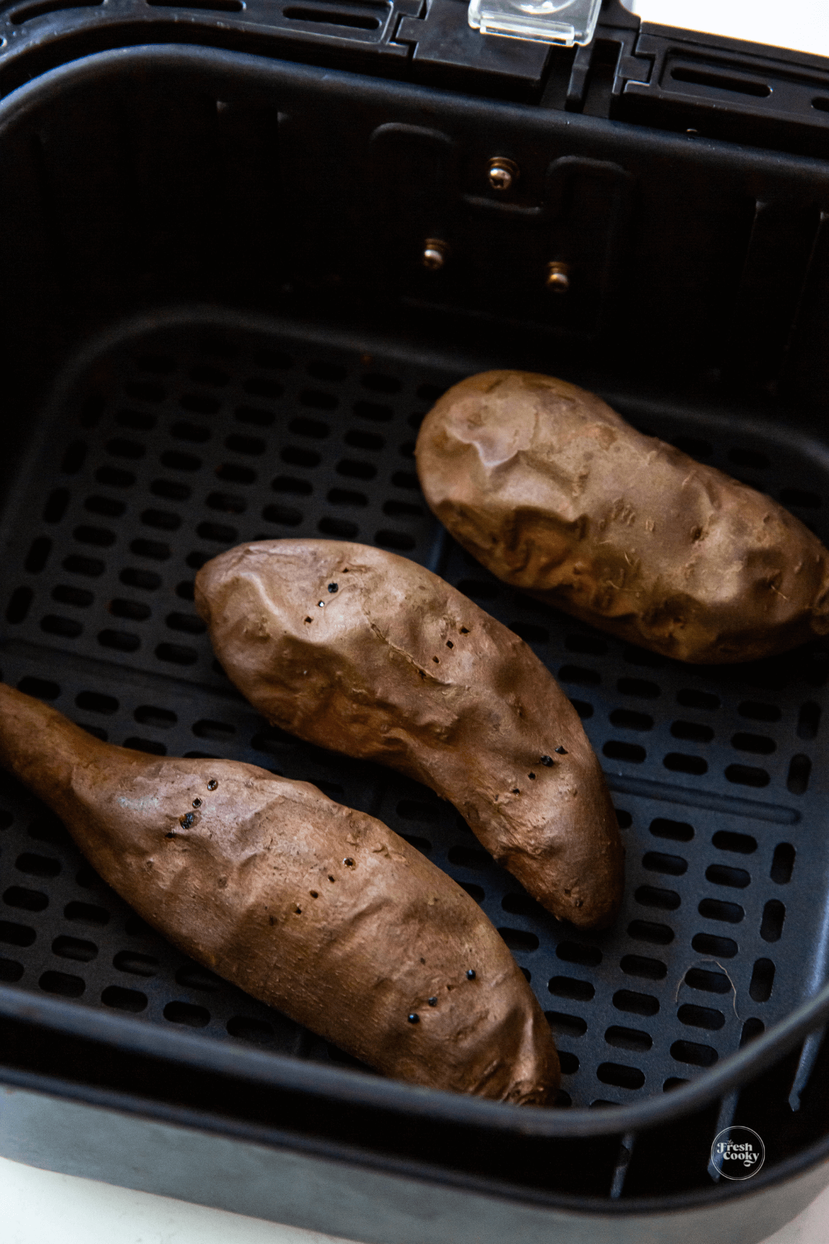 Baked air fryer sweet potatoes in air fryer. 