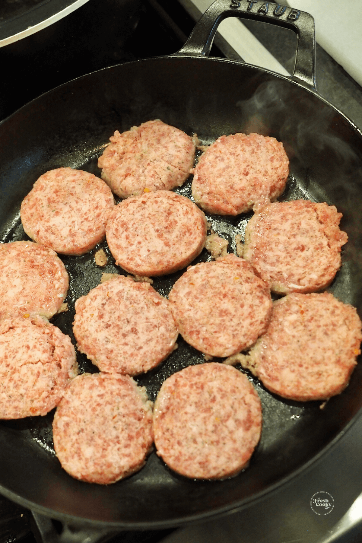 Brown sausage patties in skillet.