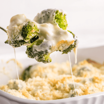 Broccoli au gratin with spoon serving.